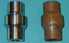 Shows an actual machined automotive part after 7 days exposure-indoors.  The part on the left was treated with VCI.  The part on the right contains only the residual machine oil from production. Copyright Kpr Adcor Inc.  2002